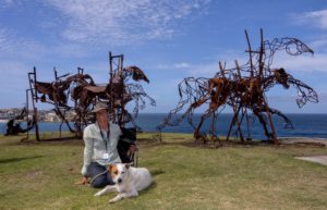 Harrie Fasher with her biggest sculpture to date, The Last Charge, at Sculpture by the Sea in Bondi, Australia, 2017. Image courtesy of Sculpture by the Sea. 